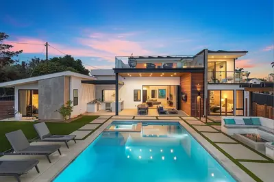 a house with a swimming pool in the backyard at Luxury Stay with Pool, Spa, Fire Pit, Outdoor Lounge & Stunning Ocean Views, Encinitas Retreat in Encinitas