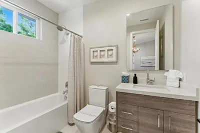 a bathroom with a toilet and a sink and a tub at Luxury Stay with Pool, Spa, Fire Pit, Outdoor Lounge & Stunning Ocean Views, Encinitas Retreat in Encinitas