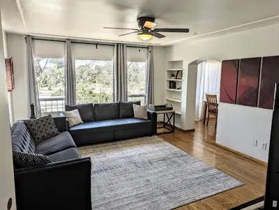 a living room with a couch and a table at Large 3 Bedroom near everything in San Diego in San Diego