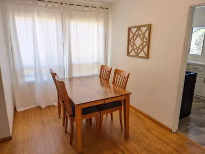 a dining room table and chairs in a room at Large 3 Bedroom near everything in San Diego in San Diego
