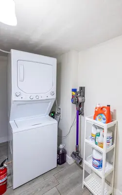 a kitchen with a washer and dryer in a room at Modern Cozy Stylish Home AC WasherDryer Parking 3 minutes to Balboa Park in San Diego