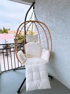 a swing chair with pillows on a balcony at Modern Cozy Stylish Home AC WasherDryer Parking 3 minutes to Balboa Park in San Diego