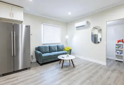 a living room with a couch and a table at Modern Cozy Stylish Home AC WasherDryer Parking 3 minutes to Balboa Park in San Diego