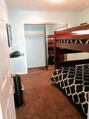a bedroom with a bed with a giraffe print at Get Your Vitamin Sea! Steps to beach! Fire pit! in Newport Beach