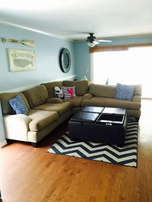 a living room with a couch and a coffee table at Get Your Vitamin Sea! Steps to beach! Fire pit! in Newport Beach