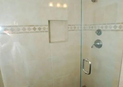 a shower with a glass door in a bathroom at Get Your Vitamin Sea! Steps to beach! Fire pit! in Newport Beach