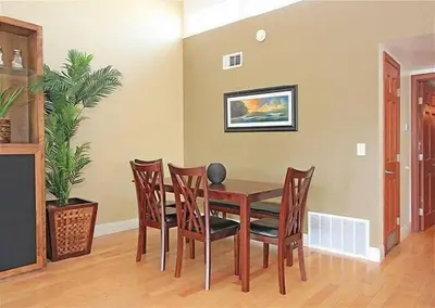 a dining room with a table and chairs at Get Your Vitamin Sea! Steps to Sand, Bikes, & Balcony in Newport Beach