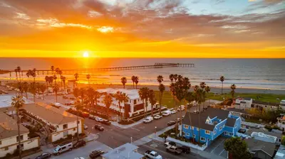 an aerial view of a city with the ocean and a pier at Huge Beach Views Starfish Cottage Ocean Beach in San Diego