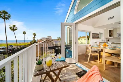 a balcony with a view of the ocean at Huge Beach Views Starfish Cottage Ocean Beach in San Diego