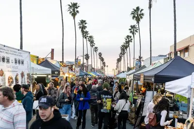 a crowd of people walking through a market at Stunning OB Ocean View Stay in San Diego