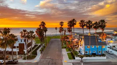 an aerial view of a town with palm trees and the ocean at Ocean Beach Cottage with Views in San Diego