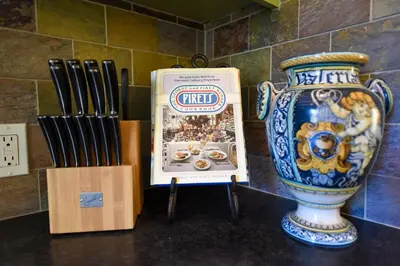 a vase and a sign on a table with chopsticks at Hidden Casita with Private Deck & Patio in San Diego