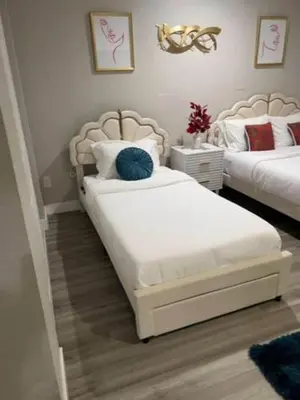 a bedroom with two beds and a blue pillow at Exotic Home Rexview by SD Stay in San Diego