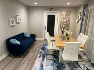 a living room with a blue couch and a table at Exotic Home Rexview by SD Stay in San Diego