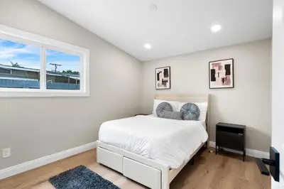 a white bedroom with a bed and a window at Exotic Home Rexview by SD Stay in San Diego