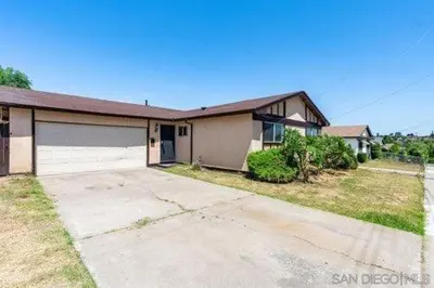 a large house with a driveway in front of it at Exotic Home Rexview by SD Stay in San Diego