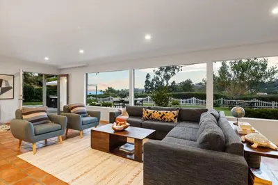 a living room with a couch and chairs at Ocean View Retreat Firepit & Spacious Yard in San Diego
