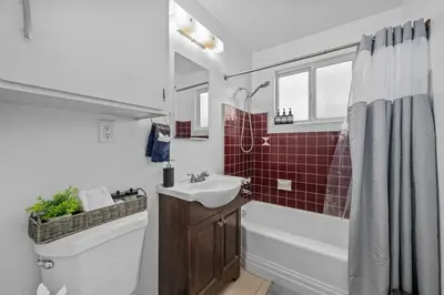 a bathroom with a sink and a tub and a toilet at Prime North Park Stay, Walk to Restaurants, Bars, and Breweries with Free Parking in San Diego