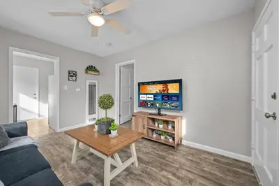 a living room with a couch and a table at Prime North Park Stay, Walk to Restaurants, Bars, and Breweries with Free Parking in San Diego