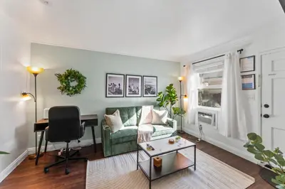 a living room with a couch and a table at Colorful & Cozy Oasis in North Park Walk to Restaurants, Bars, and Breweries in San Diego