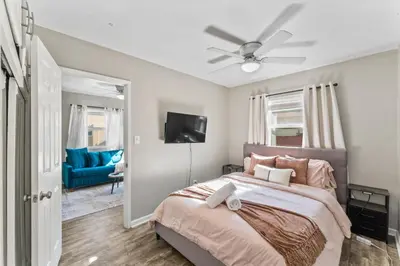 a bedroom with a bed and a ceiling fan at Stylish & Comfy Gem in North Park, Walk to Restaurants, Bars, and Breweries in San Diego