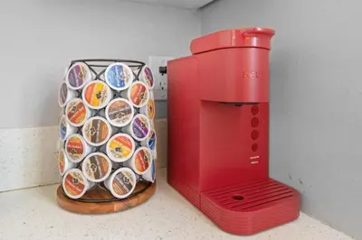 a red machine sitting on a counter next to a container of food at Stylish & Comfy Gem in North Park, Walk to Restaurants, Bars, and Breweries in San Diego