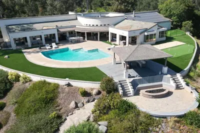 an aerial view of a house with a swimming pool at Private Gated 6BR Luxury Estate, Gym, Lake View in Escondido
