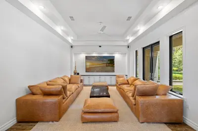a living room with couches and a table at Private Gated 6BR Luxury Estate, Gym, Lake View in Escondido