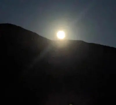 a sun setting on top of a hill at Alpine's Gorgeous Guest Home in Alpine