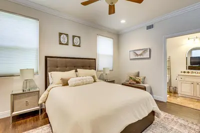 a bedroom with a large bed and a ceiling fan at Outdoor Oasis! Luxe Hilltop Home in San Marcos in San Marcos