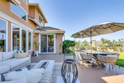 a patio with a couch and a table with an umbrella at Outdoor Oasis! Luxe Hilltop Home in San Marcos in San Marcos