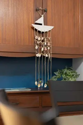 a chandelier is hanging from a wooden wall at 10 Min to the Beach Colorful Home Huge Yard in San Diego