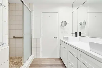 a white bathroom with two sinks and a shower at Luxury La Jolla Villa Ocean Views & Private Pool in San Diego