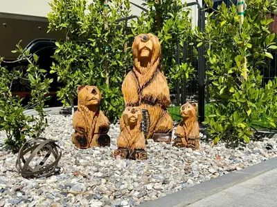 a statue of three bears sitting on a pile of rocks at Rancho CA 78 in Aguanga