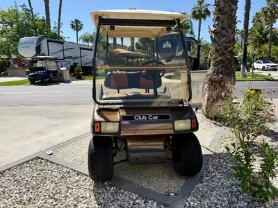 a golf cart parked in a parking lot at Rancho CA 78 in Aguanga