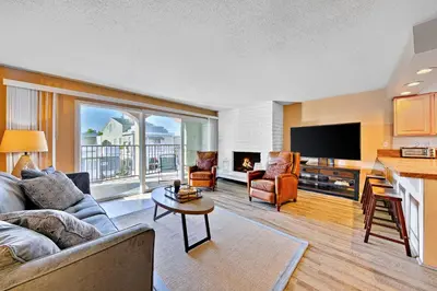 a living room with a couch and a table at Newport Beach Simplicity II in Newport Beach