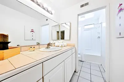 a bathroom with a sink and a mirror at Newport Beach Simplicity II in Newport Beach