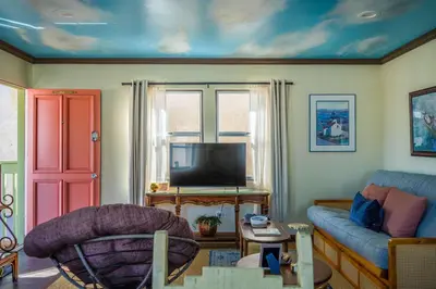 a living room with a couch and a tv at Catch of the Day Pet-Friendly El Pescador 1 Block from the Beach in San Diego