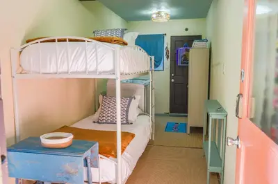 a bedroom with two bunk beds in a room at Catch of the Day Pet-Friendly El Pescador 1 Block from the Beach in San Diego