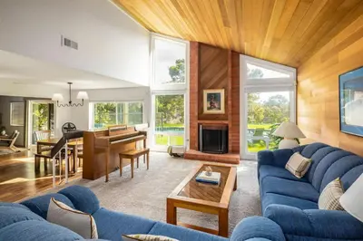 a living room with a blue couch and a table at Hot Tub Pool 3Bed Home in Encinitas