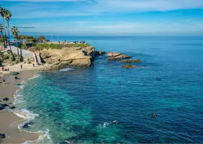 an aerial view of a beach with people in the water at Travelers Dream Home SDSU Hot Tub Pool Table in San Diego