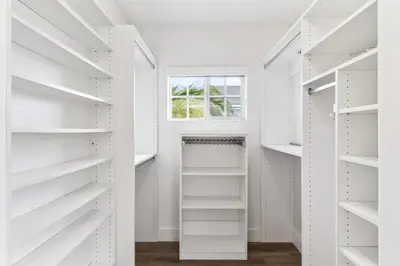 a white walk in closet with a window at Steps to Lido Village and the Marina Heart of Lido Island 2 Car Garage in Newport Beach