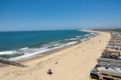 a view of a beach with people and the ocean at 4 Car Parking Steps 2 Lido Village Marina Phenomenal Location in Newport Beach