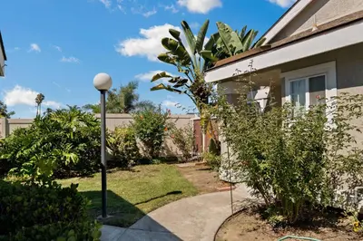 a house with a street light in the yard at Lux Modern Pet Friendly | Pool | Hot Tub | Tennis in Oceanside