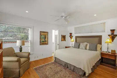 a bedroom with a bed and a couch and a chair at Seaview craftsman with Amazing views in San Diego