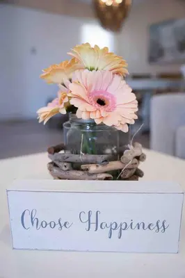 a vase of flowers sitting on top of a table at Coastal Chill San Diego - Heated Pool - XXL Spa - Mini Golf - Gourmet Kitchen in San Diego
