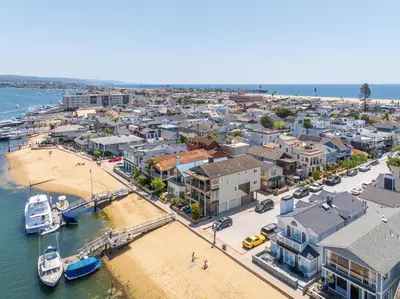 an aerial view of a city with a harbor at Bay Breeze in Newport Beach