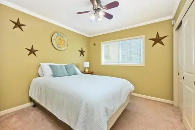 a bedroom with a bed with stars on the wall at Bay Breeze in Newport Beach