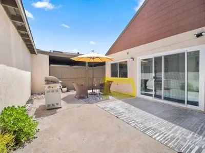 a patio with an umbrella in front of a house at Recently updated home close to La Jolla & Del Mar- 2 bedrooms home in San Diego