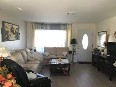 a living room with a couch and a table at Guest Suites in High Tech Park in Rancho Bernardo